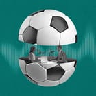 Two podcasters speak to eachother from inside a soccer ball that is split in half.