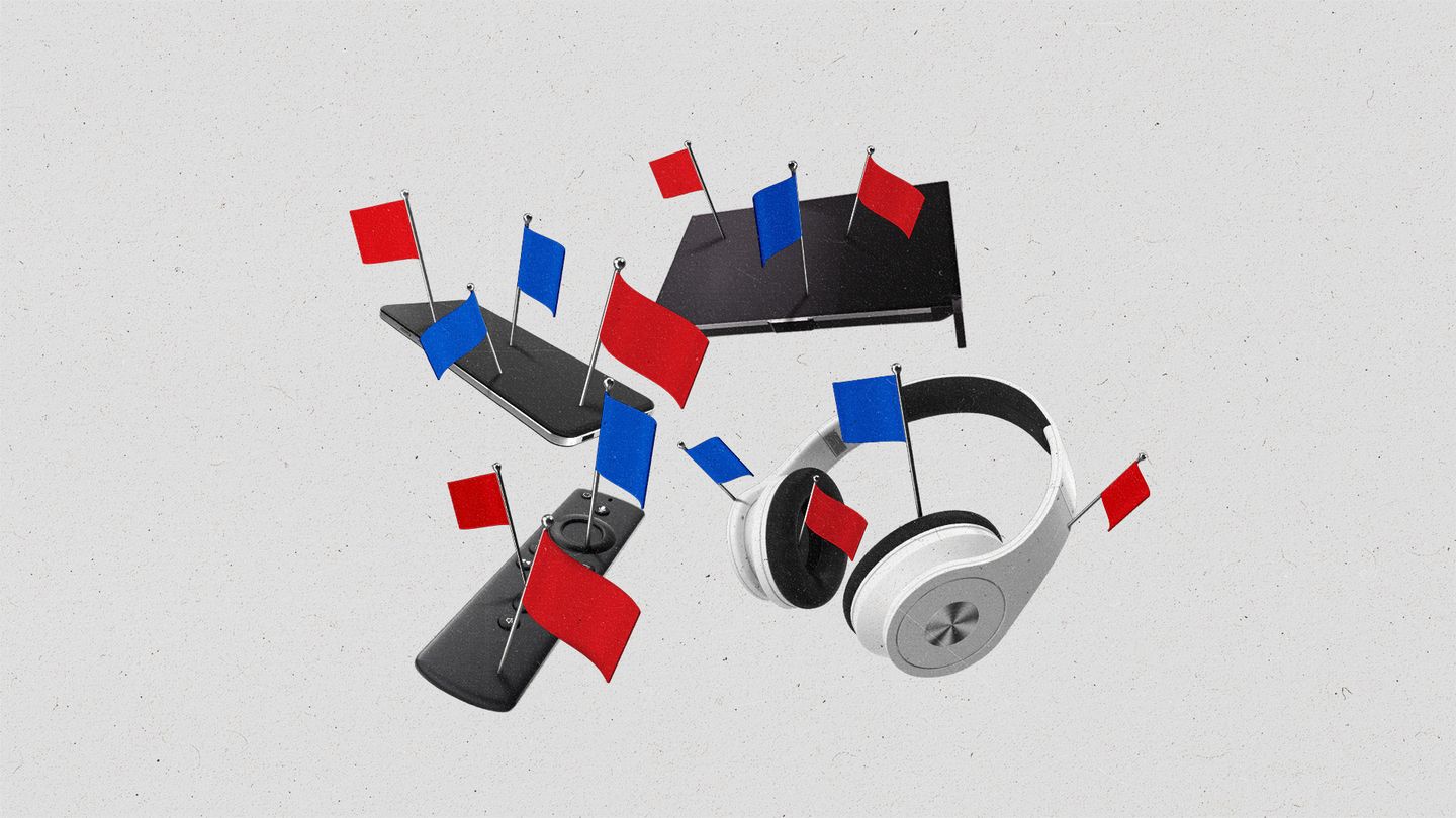 Various devices with red and blue flags staked into them