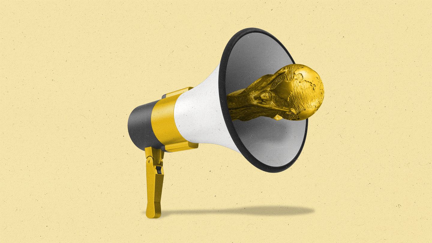 A megaphone with the World Cup trophy sticking out of it.