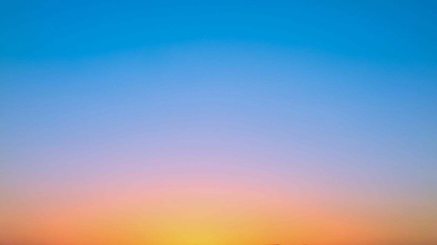 Gradation of sun set orange to sky blue in twilight time