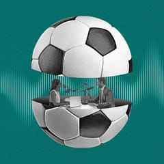 Two podcasters speak to eachother from inside a soccer ball that is split in half.