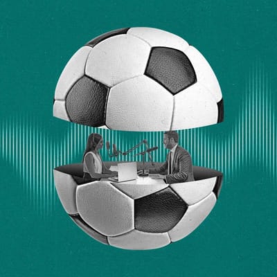 Two podcasters speak to eachother from inside a soccer ball that is split in half.