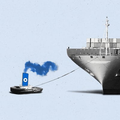 A tug boat with a phone and play button pulls a giant ship
