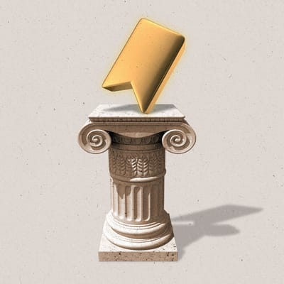 An ornate pillar with a golden bookmark symbol sitting ontop of it.