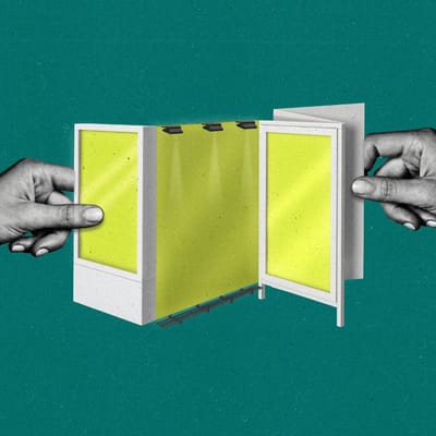 Hands pull open a brochure with it's pages resembling various digital out of home displays and billboard