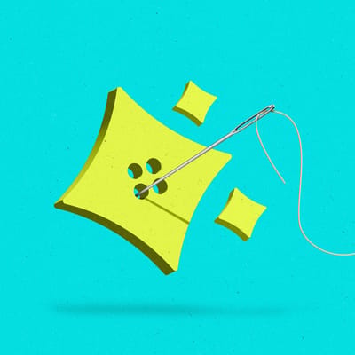 AI sparkle-shaped button with a needle and thread running through it.
