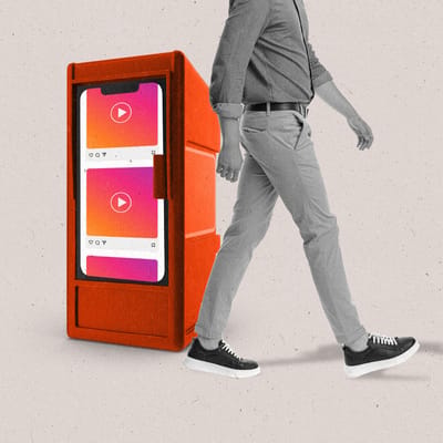 A newstand with the front made to look like a social media feed on a smartphone as a person walks past it.