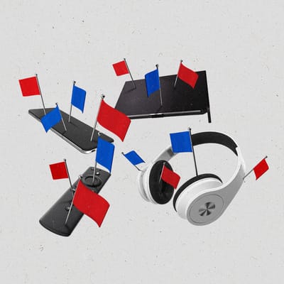 Various devices with red and blue flags staked into them