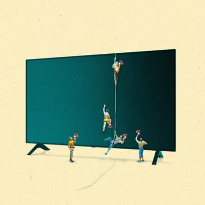 A group of climbers scaling a TV while holding megaphones