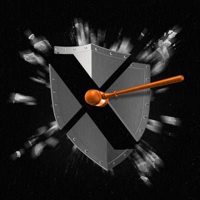 A shield with an X cut out in it being struck by a gavel
