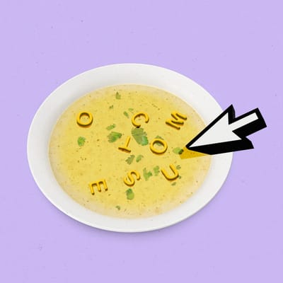 A bowl of alphabet soup with the letters o,u,t,c,o,m,e,s, and a cursor floating in the liquid.