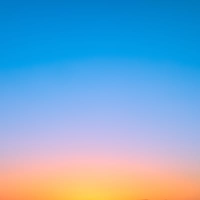 Gradation of sun set orange to sky blue in twilight time