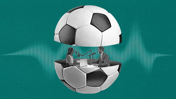 Two podcasters speak to eachother from inside a soccer ball that is split in half.