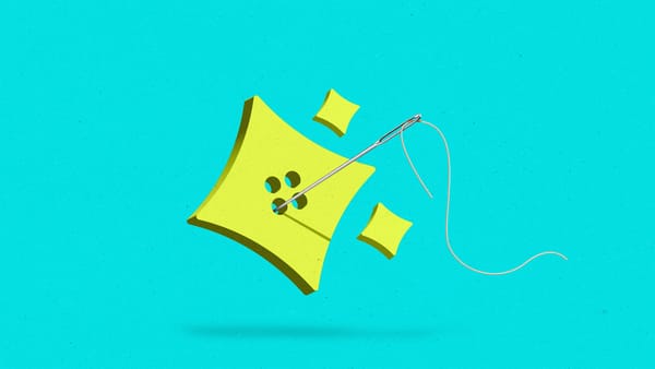 AI sparkle-shaped button with a needle and thread running through it.