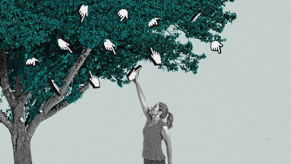 A woman reaches up a picks a finger cursor off of a tree.
