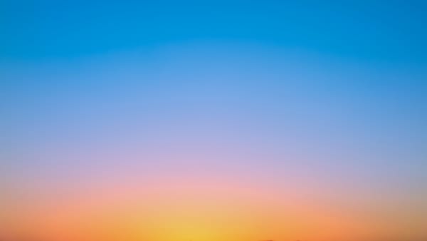 Gradation of sun set orange to sky blue in twilight time